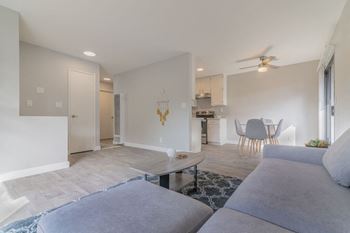 a living room with a couch and a table at The Gates at The Marina Apartments, Marina, CA 93933